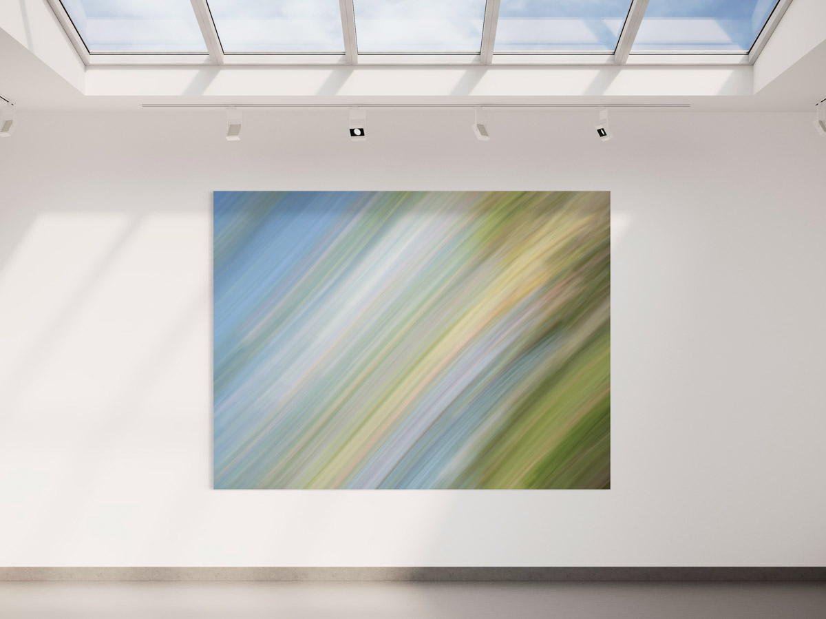 A large painting of green and blue colors in a room.