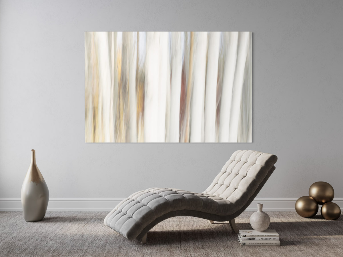 A white painting hanging on the wall of a living room.
