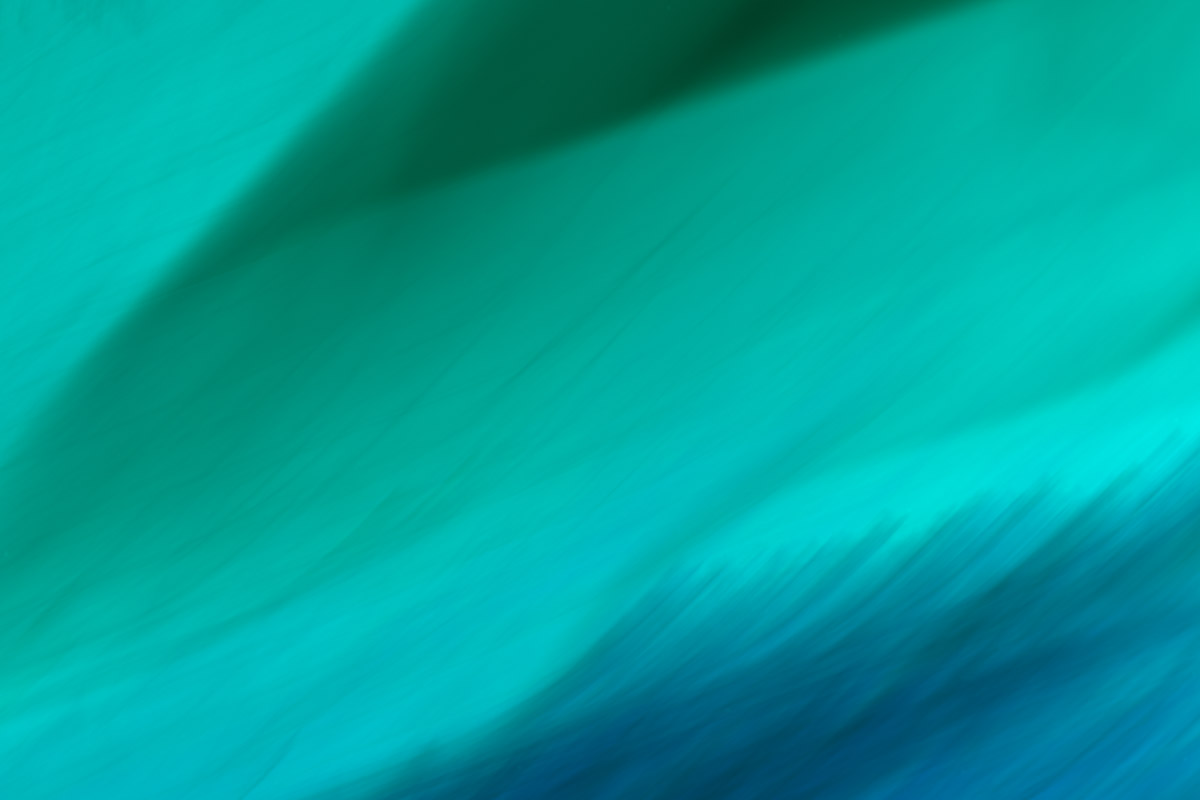 A blue and green abstract background with some waves